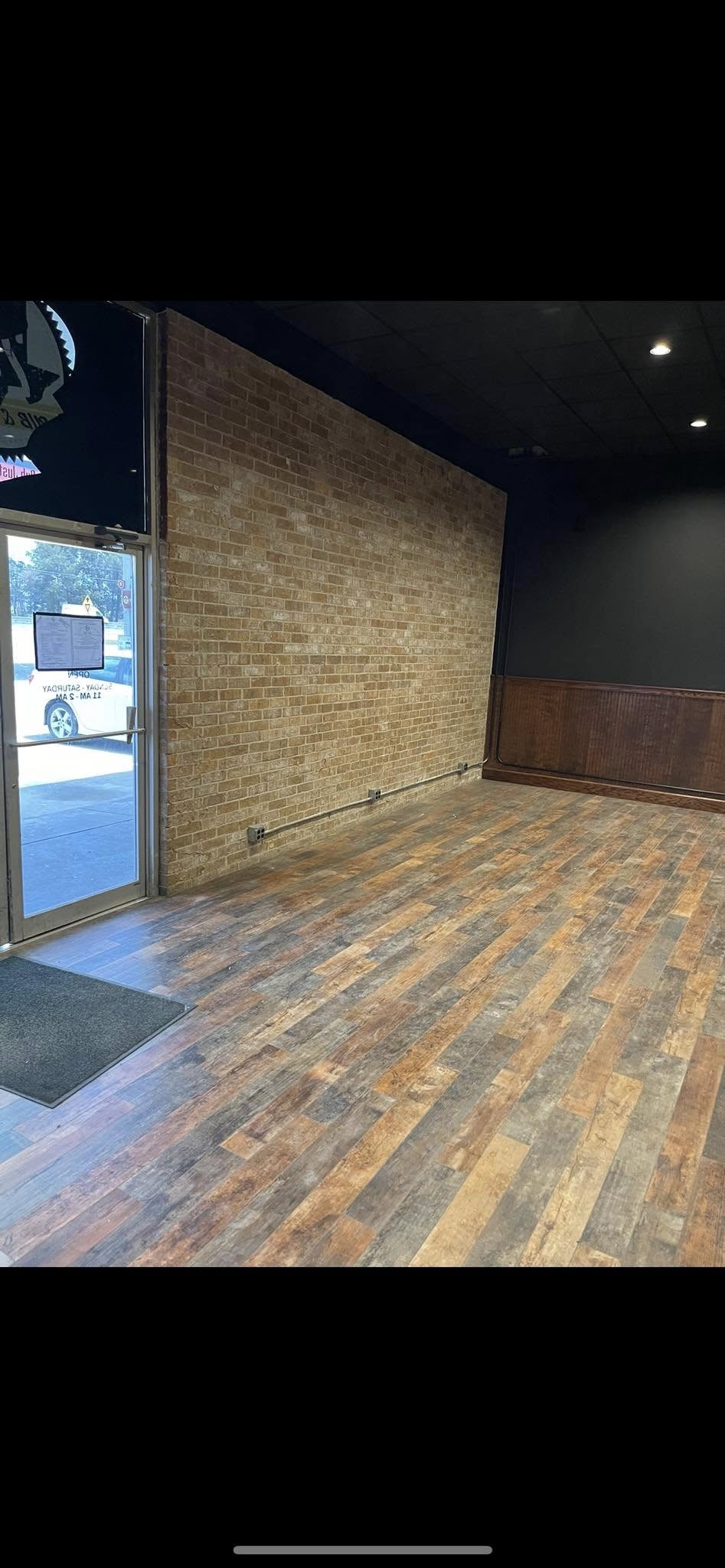 JNL Flooring restaurant installation showing plank flooring across the room